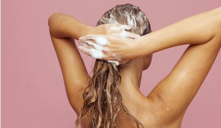 woman washing wavy hair